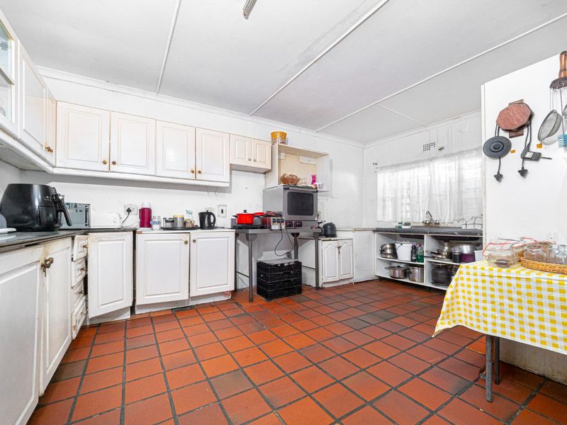 This Versatile Double-Storey property offers the perfect opportunity for renovation and customization with independent Upper and Lower Living (Homes) - Photo 8