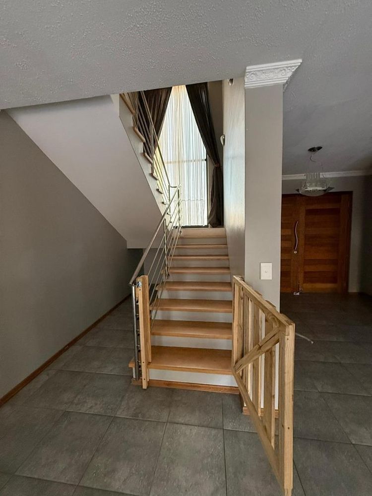 view of the stairs to the 2 bedrooms