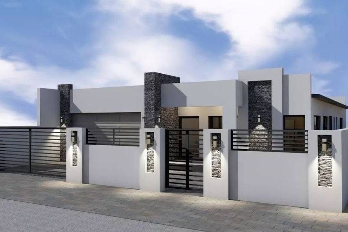 Modern residential facade featuring clean architectural lines, stone-clad pillars, integrated wall lighting, and a secure gated entrance.