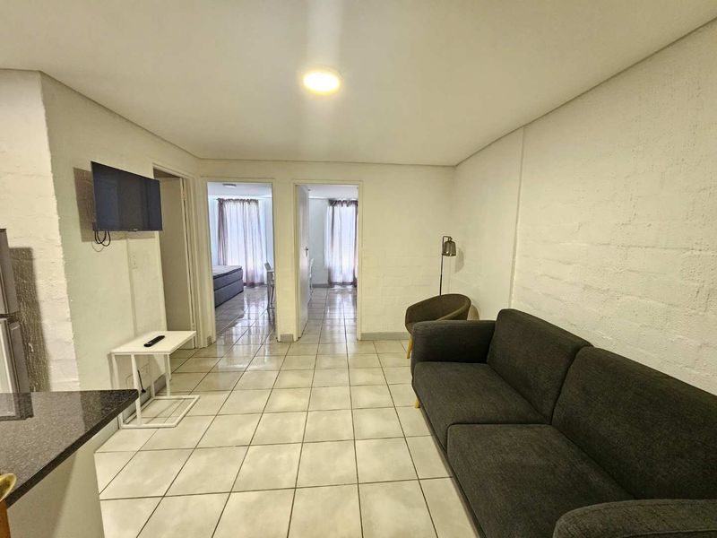 Beautifully renovated and furnished 2 Bed 1 Bath Apartment with open plan living area with kitchenette - Photo 9