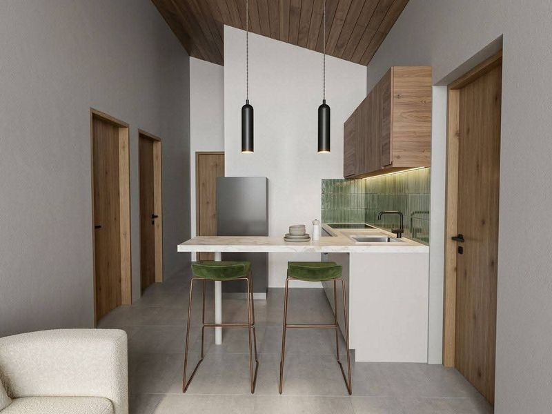 Modern open-plan kitchen area featuring timber ceiling accents, sleek cabinetry, stone countertops, and a stylish tiled backsplash with integrated lighting.
