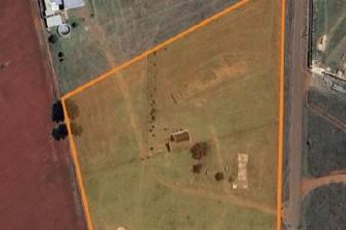 An aerial view of the small holding property, highlighting the land boundaries and existing structures on the plot.