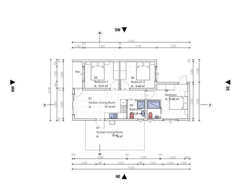 Architectural floor plan showing the layout of a townhouse including two bedrooms, a bathroom, and an open-plan kitchen and living area.