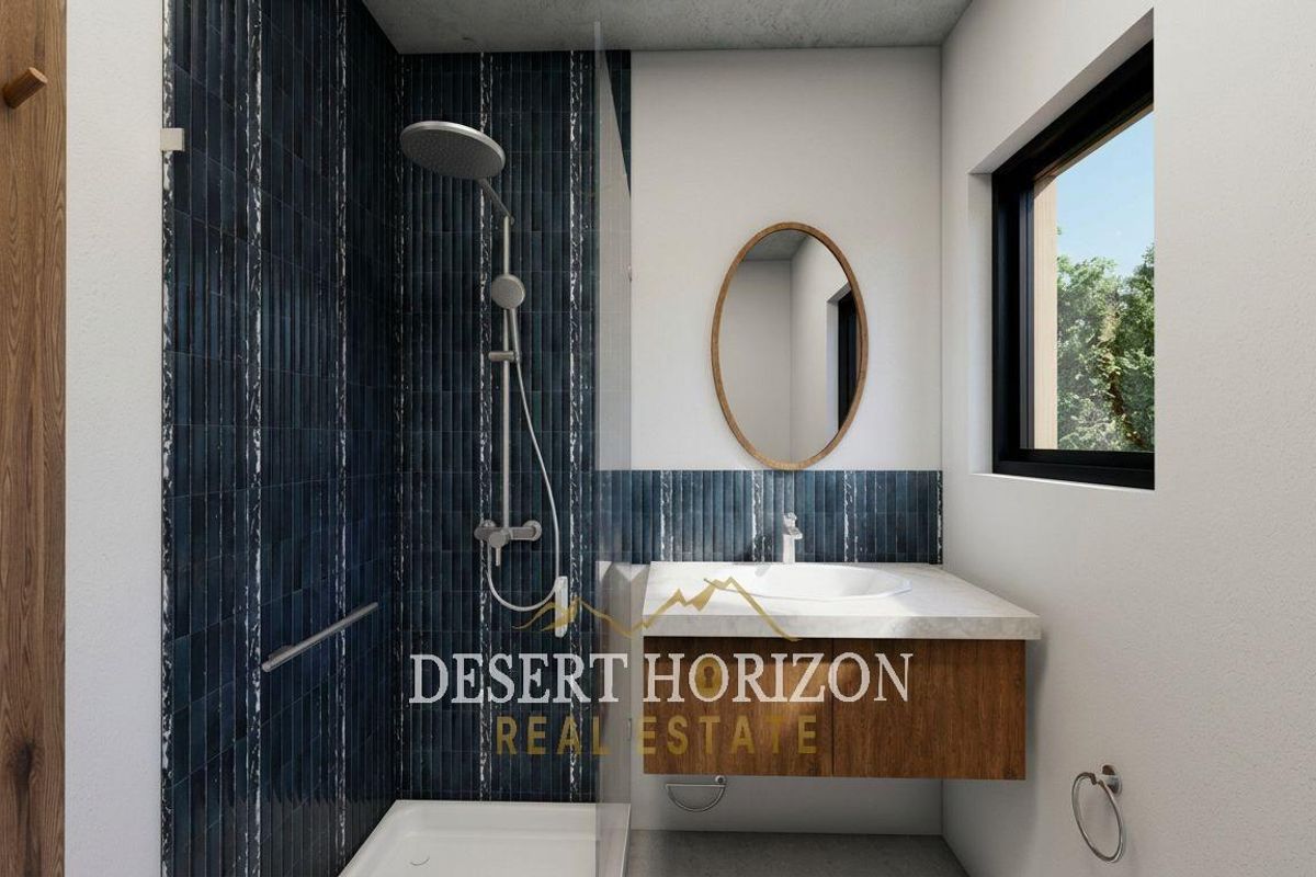 Modern bathroom featuring a walk-in shower with dark blue textured tiling, a floating vanity with a basin, and a sleek wall-mounted mirror.