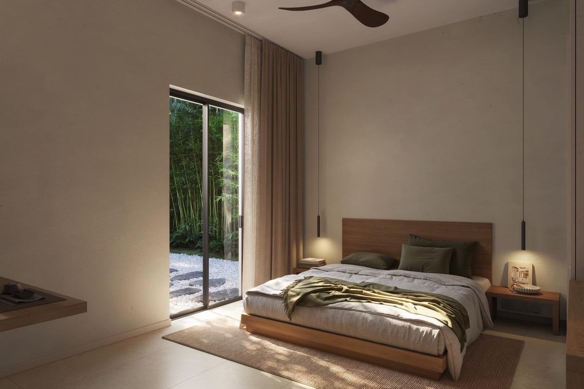 A modern, well-lit bedroom featuring a ceiling fan, recessed lighting, pendant lights, and a sliding glass door providing access to a private garden area.