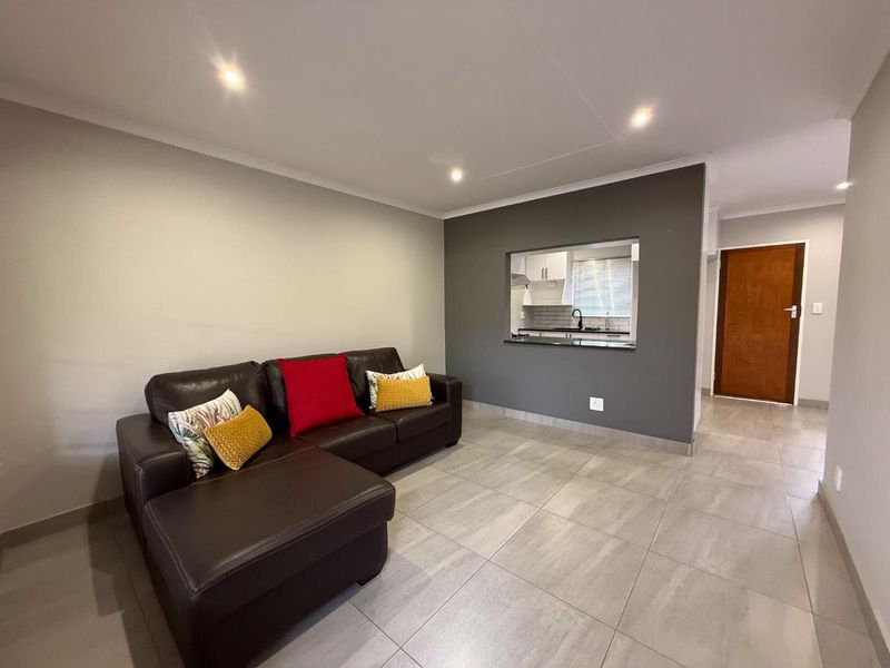 Stylishly Renovated Two-Bedroom Simplex with Double Garage and Garden - Photo 4
