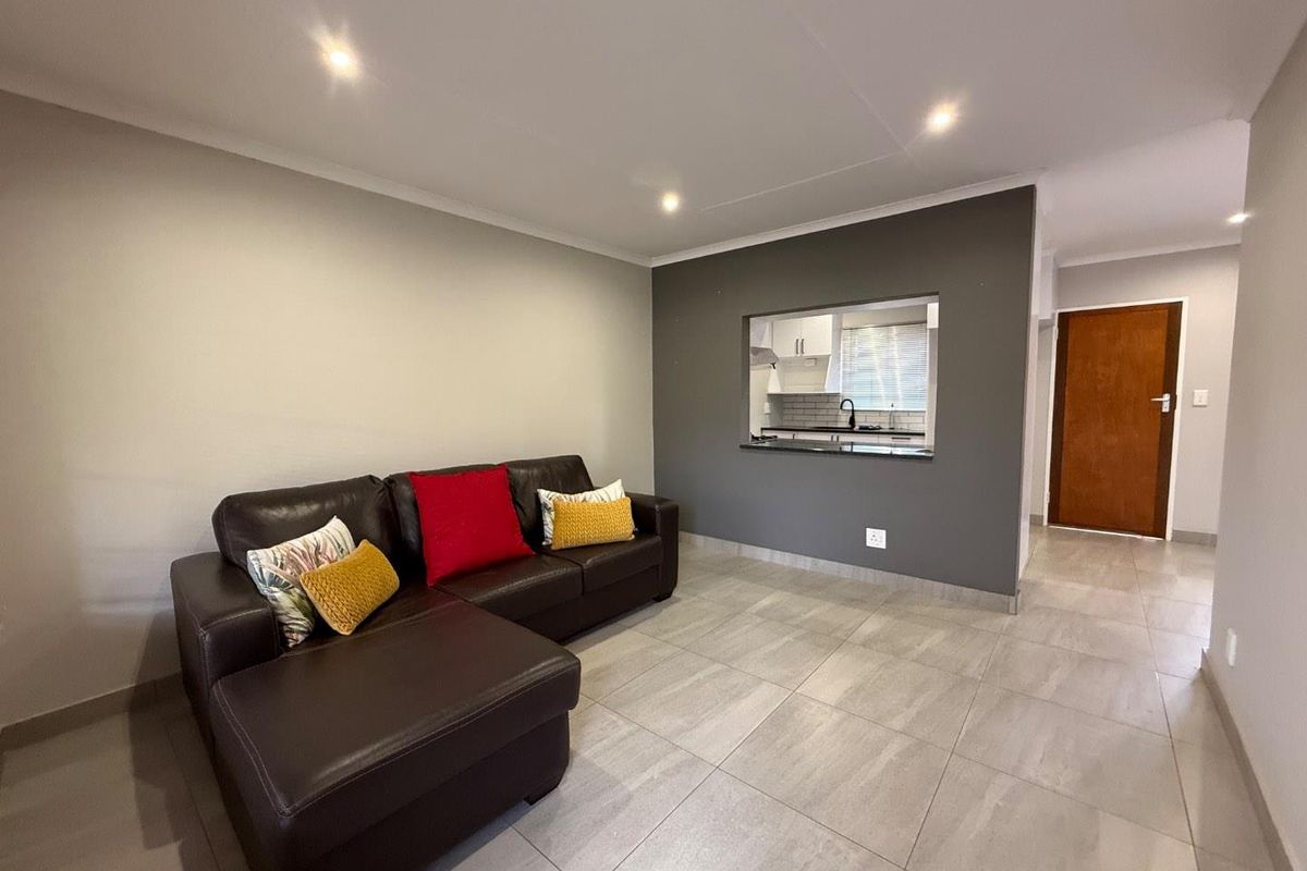 Stylishly Renovated Two-Bedroom Simplex with Double Garage and Garden - Photo 4