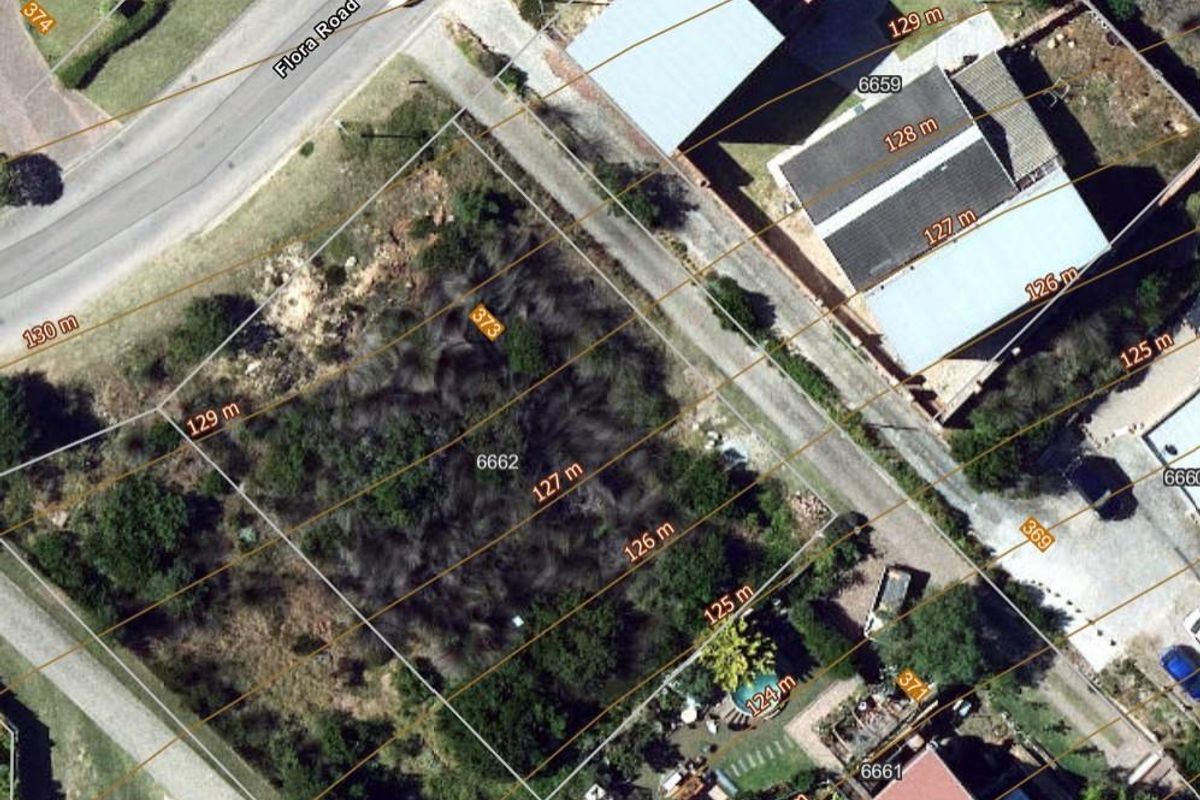 Aerial view of a vacant residential plot located on Flora Road, showing current vegetation and boundary lines.