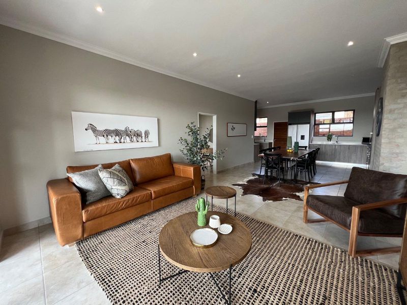 Unique iQ Marula 3-Bedroom Single-Level Townhouse with stacking doors by the patio and Double Garage - Photo 3