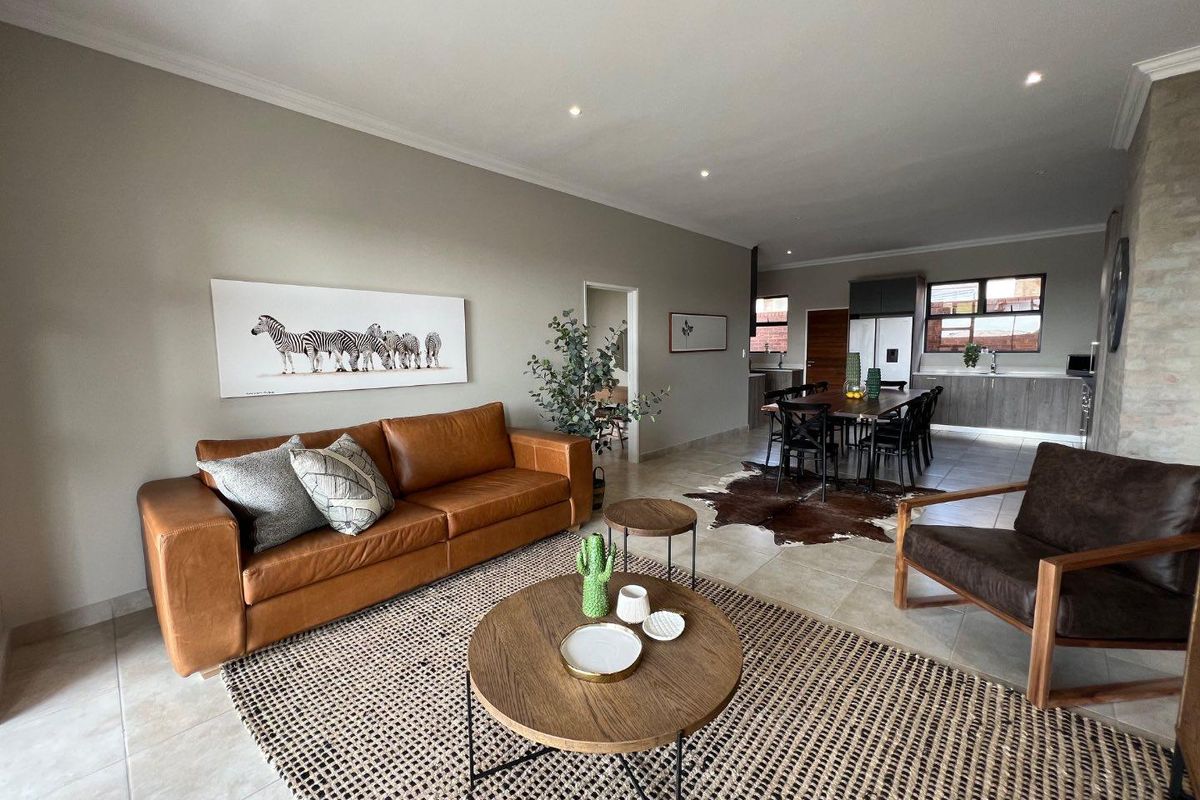 Unique iQ Marula 3-Bedroom Single-Level Townhouse with stacking doors by the patio and Double Garage - Photo 3