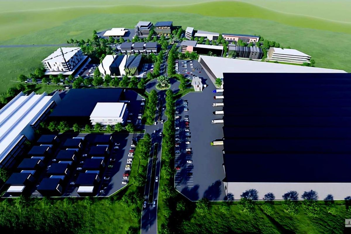Aerial rendering of a large-scale industrial park development featuring multiple warehouse units, office buildings, and extensive parking infrastructure.