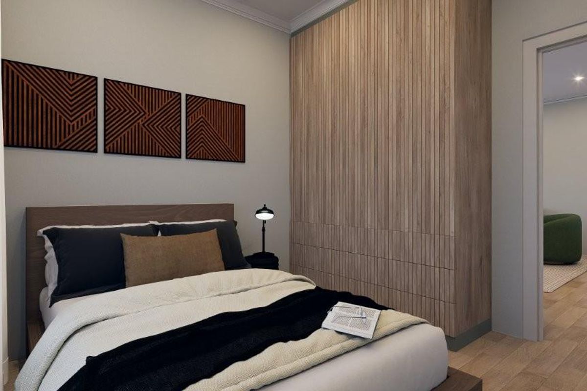 A modern bedroom featuring built-in floor-to-ceiling timber-look cabinetry and light wood flooring, offering a clean and contemporary aesthetic.