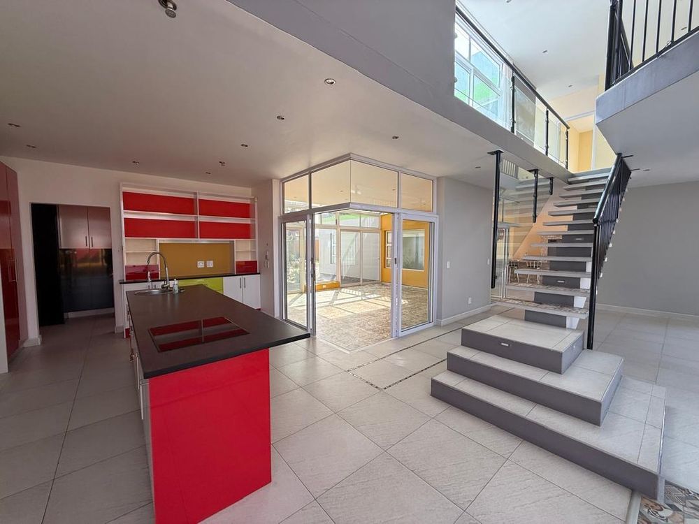 Kitchen, sun room and staircase