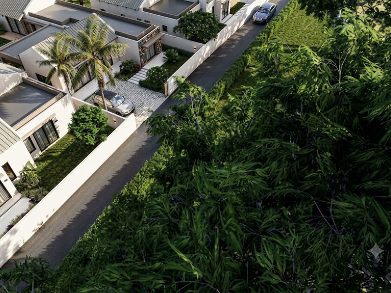 An elevated aerial view of a modern residential property featuring a paved driveway, landscaped garden, and contemporary architectural design.