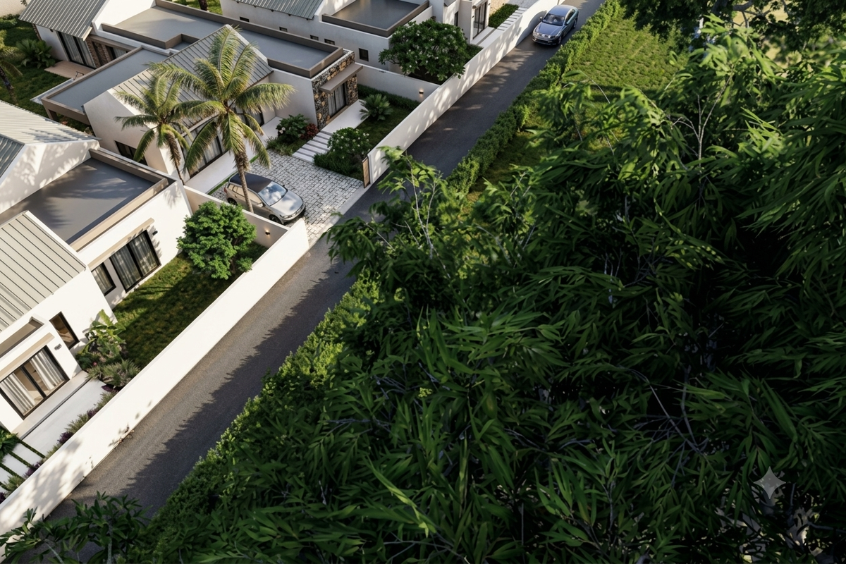 An elevated aerial view of a modern residential property featuring a paved driveway, landscaped garden, and contemporary architectural design.