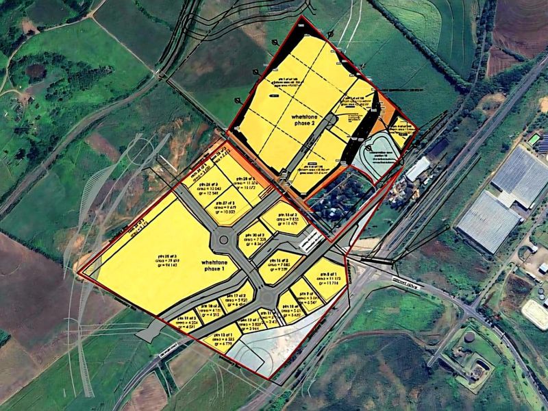 Aerial view of the Whetstone industrial development site, showing phase 1 and phase 2 land parcels and infrastructure layout.