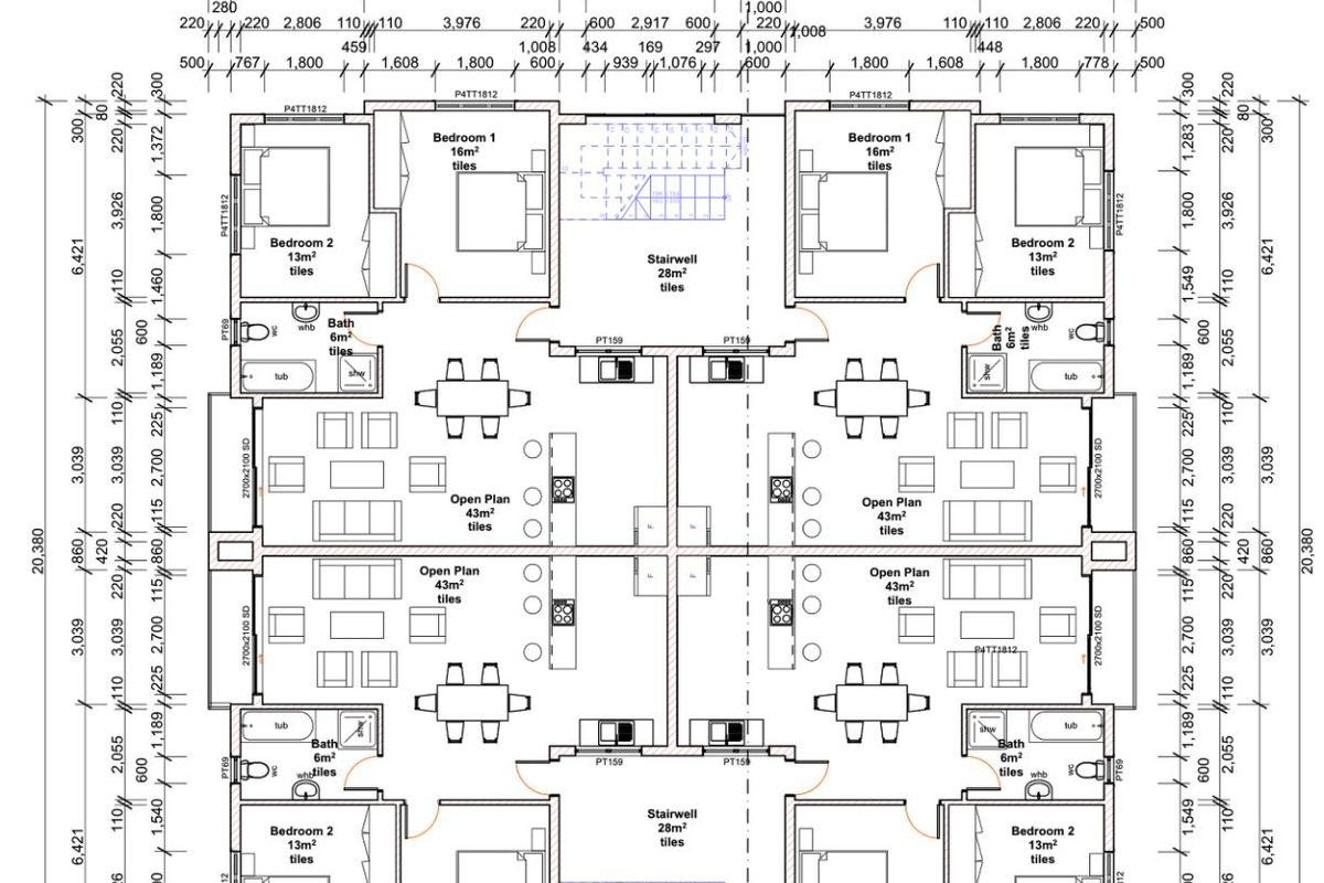 Architectural floor plan showing the layout of a multi-unit apartment building with open plan living areas, bedrooms, bathrooms, and central stairwells.