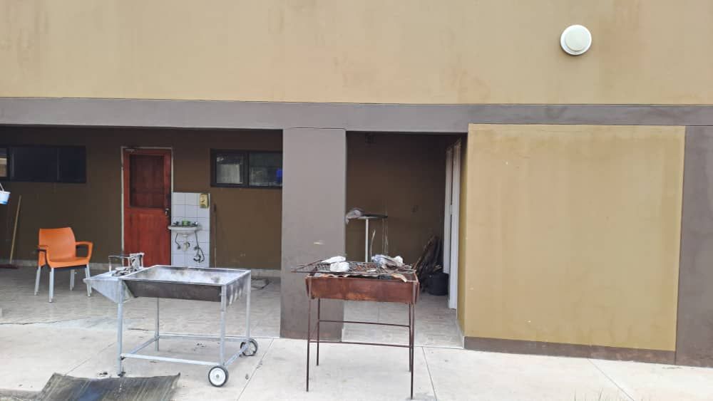 Veranda, at the back of the kitchen.