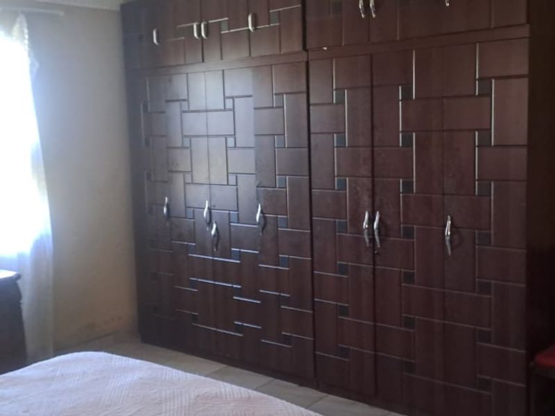 Peaceful 3-Bedroom Family Home with 2 Rondavels for Extra Income Potential - Photo 4