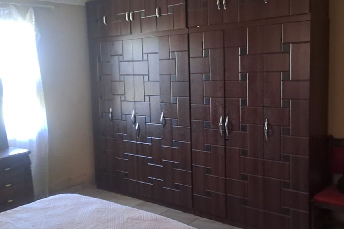 Peaceful 3-Bedroom Family Home with 2 Rondavels for Extra Income Potential - Photo 4