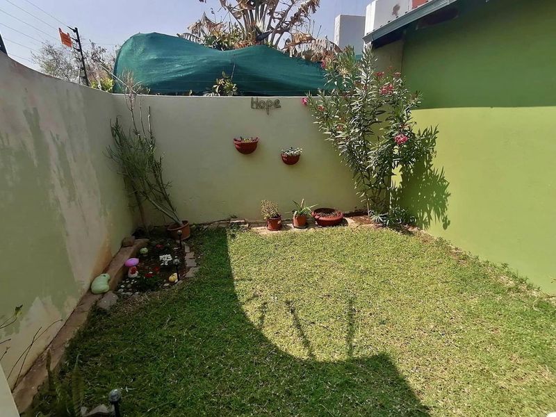 This charming 3-bedroom home offers spacious living areas, a modern kitchen, and a cozy backyard perfect for relaxation. - Photo 10