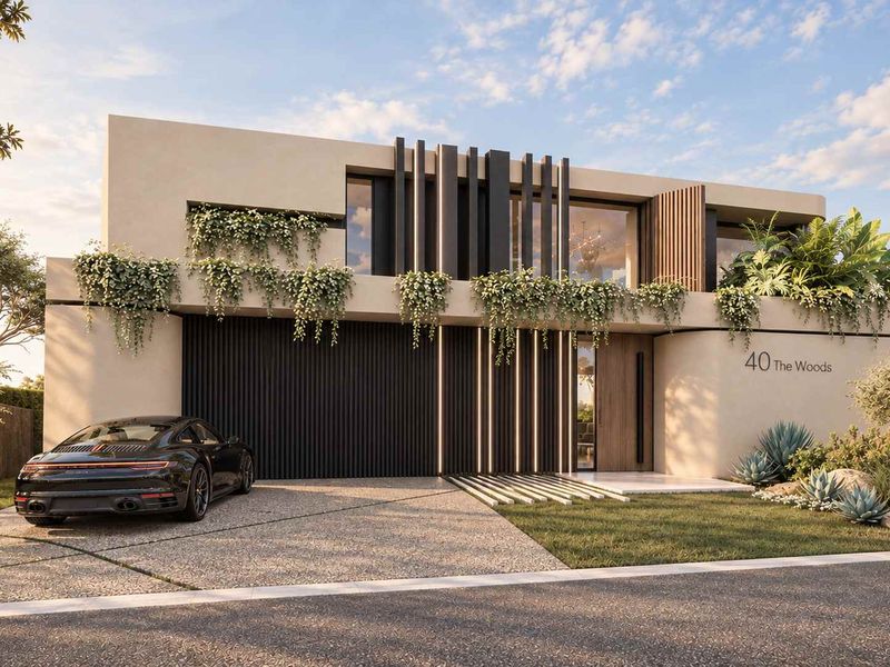 Modern architectural front facade featuring clean lines, integrated garage, vertical feature fins, and landscaped garden elements.