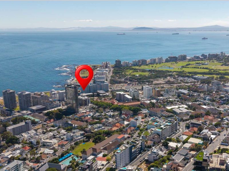 Aerial view of the coastal urban neighborhood showing the property location relative to the ocean and surrounding city infrastructure.