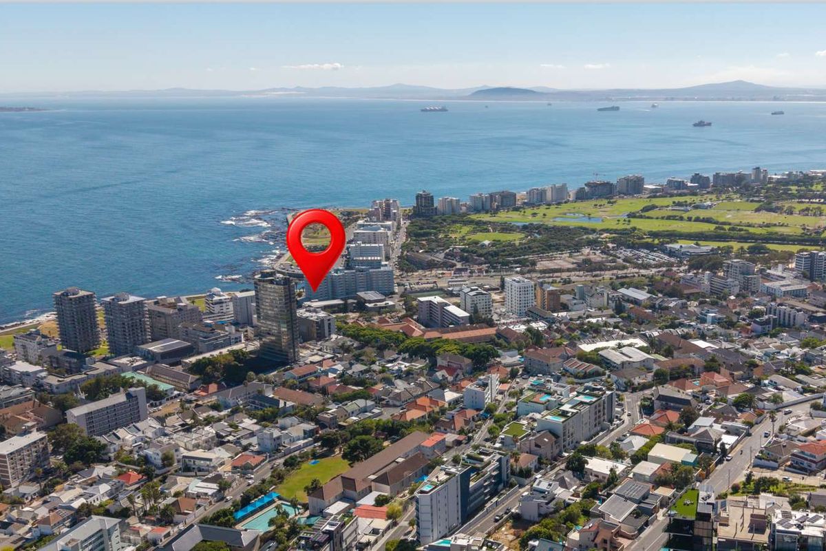 Aerial view of the coastal urban neighborhood showing the property location relative to the ocean and surrounding city infrastructure.