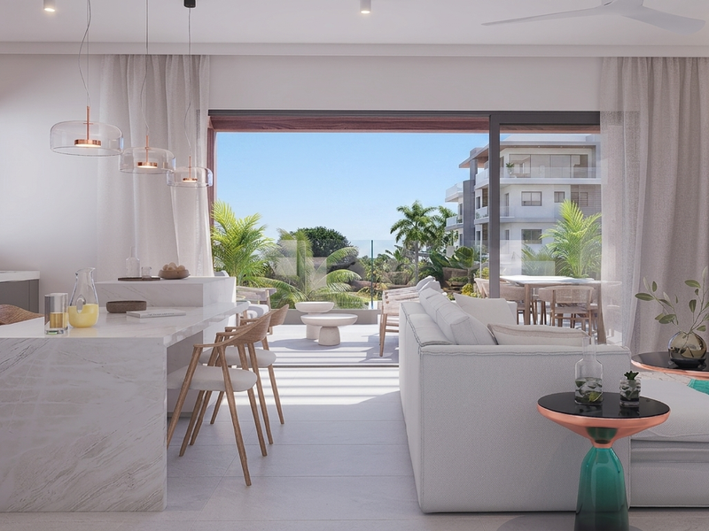 Modern open-plan living area featuring a marble kitchen island, sleek cabinetry, and seamless transition to a private balcony with glass balustrades.