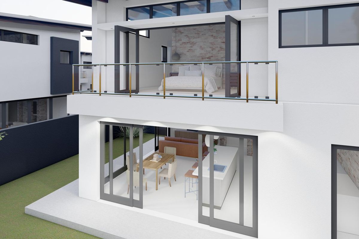 A modern townhouse exterior featuring a ground floor open-plan living area with sliding doors and a private upper-level balcony with glass balustrades.