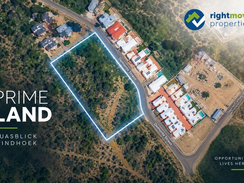 An aerial view of a prime vacant residential plot located in Auasblick, Windhoek, featuring clear street access and surrounding residential development.