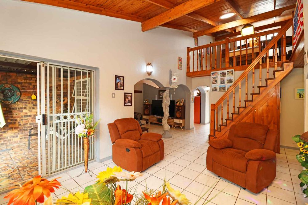 Living Area with steps leading to the Loft with Bar & Pool Table