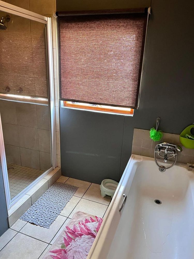 Bathroom with a shower and a bathtub