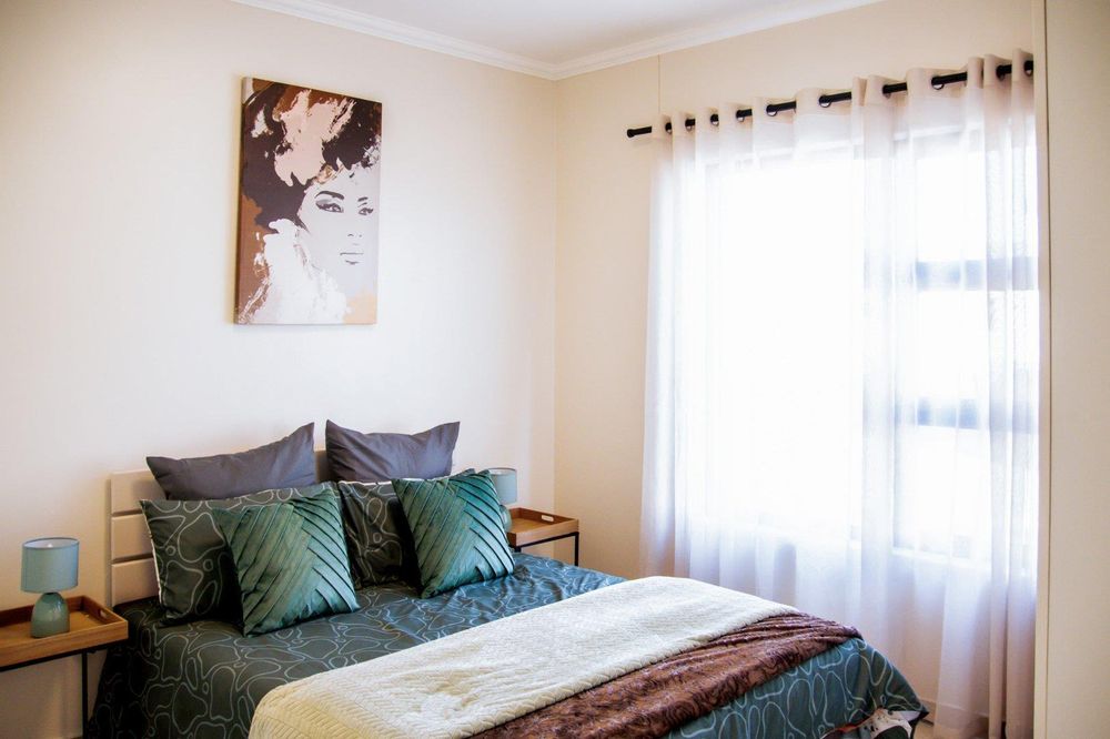 Third bedroom with built-in cupboards.