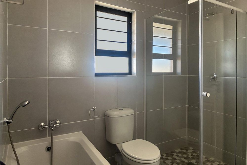 Family bathroom with bath & shower.