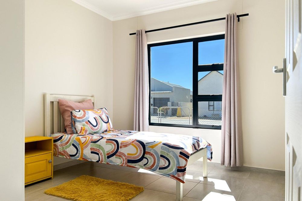 Third bedroom with built-in cupboards.