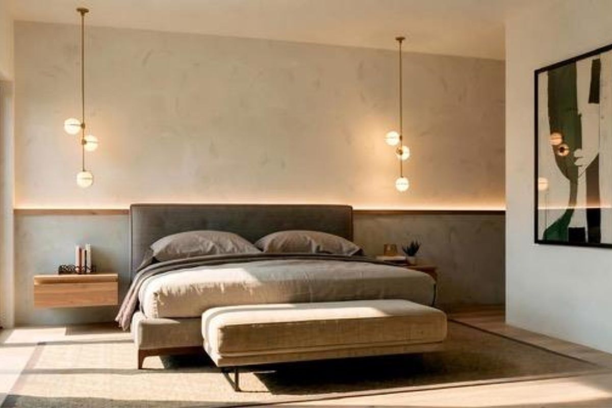 A modern, elegantly designed bedroom featuring warm ambient LED strip lighting, stylish pendant fixtures, and direct access to outdoor space via sliding glass doors.