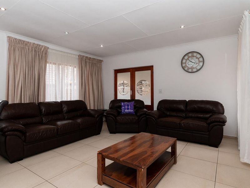 Lovely 3-bedroom facebrick home with a pool situated in a secure estate in Glen Marais - Photo 7