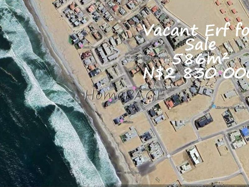 Aerial view of a 586m² vacant residential erf located in a coastal neighborhood.