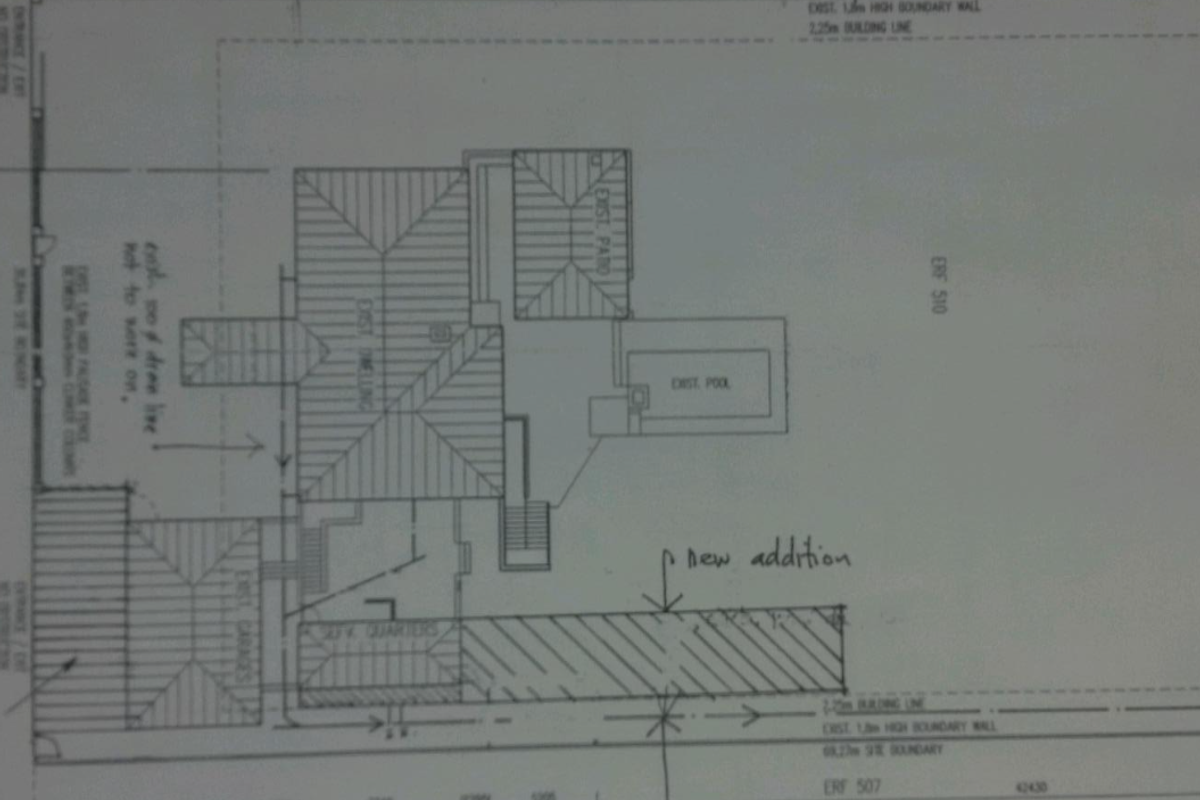 Architectural site plan showing the existing dwelling, pool, patio, garage, and proposed new addition on the residential erf.