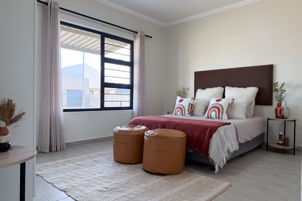 Main bedroom with built-in cupboards.