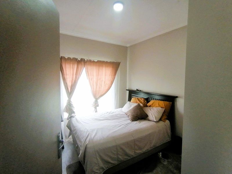 Charming 2-bedroom Cluster House - Photo 9