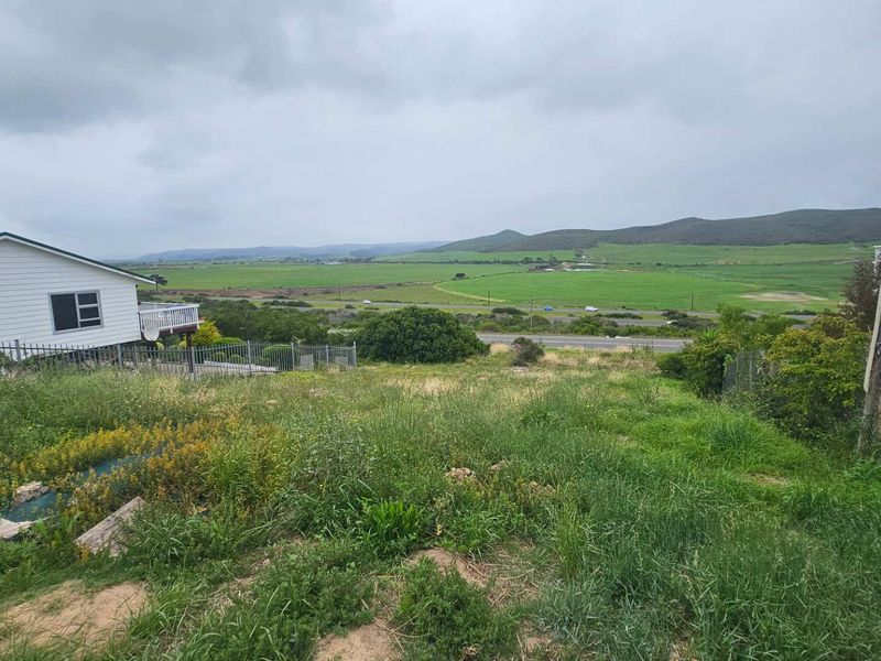 A view of the vacant residential land looking out over the surrounding rural landscape and distant hills.