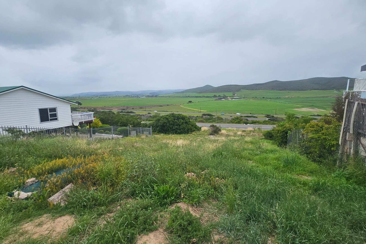 A view of the vacant residential land looking out over the surrounding rural landscape and distant hills.