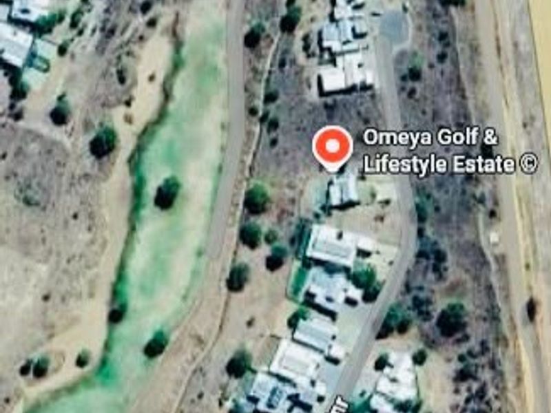 Aerial view of Omeya Golf and Lifestyle Estate showing the residential layout, golf course, and surrounding road infrastructure.
