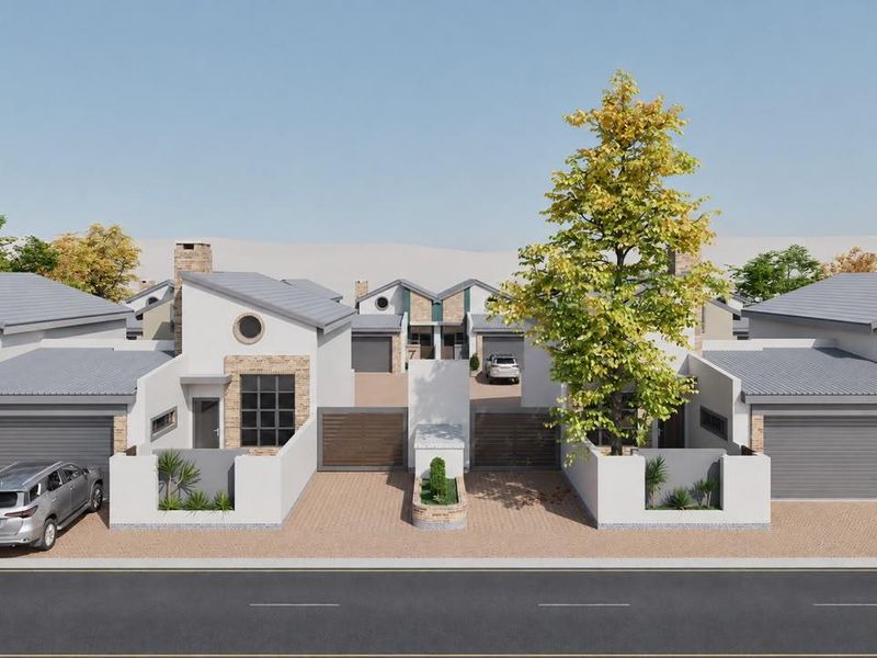 A modern townhouse development featuring brick and plaster facades, tiled roofs, and private paved driveways with integrated garage access.