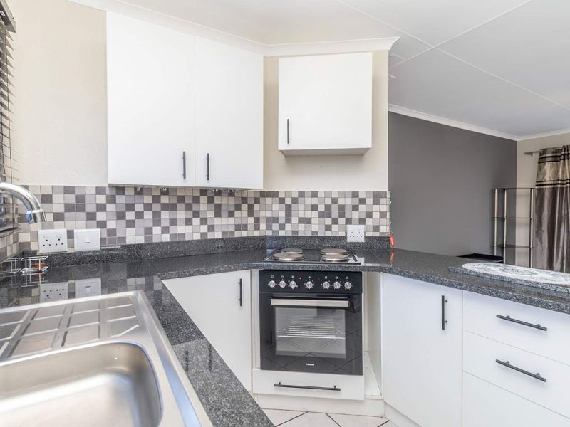Spacious 1 Bedroom Townhouse with Expansive Private Garden | Sunrock Village Gem - Photo 9