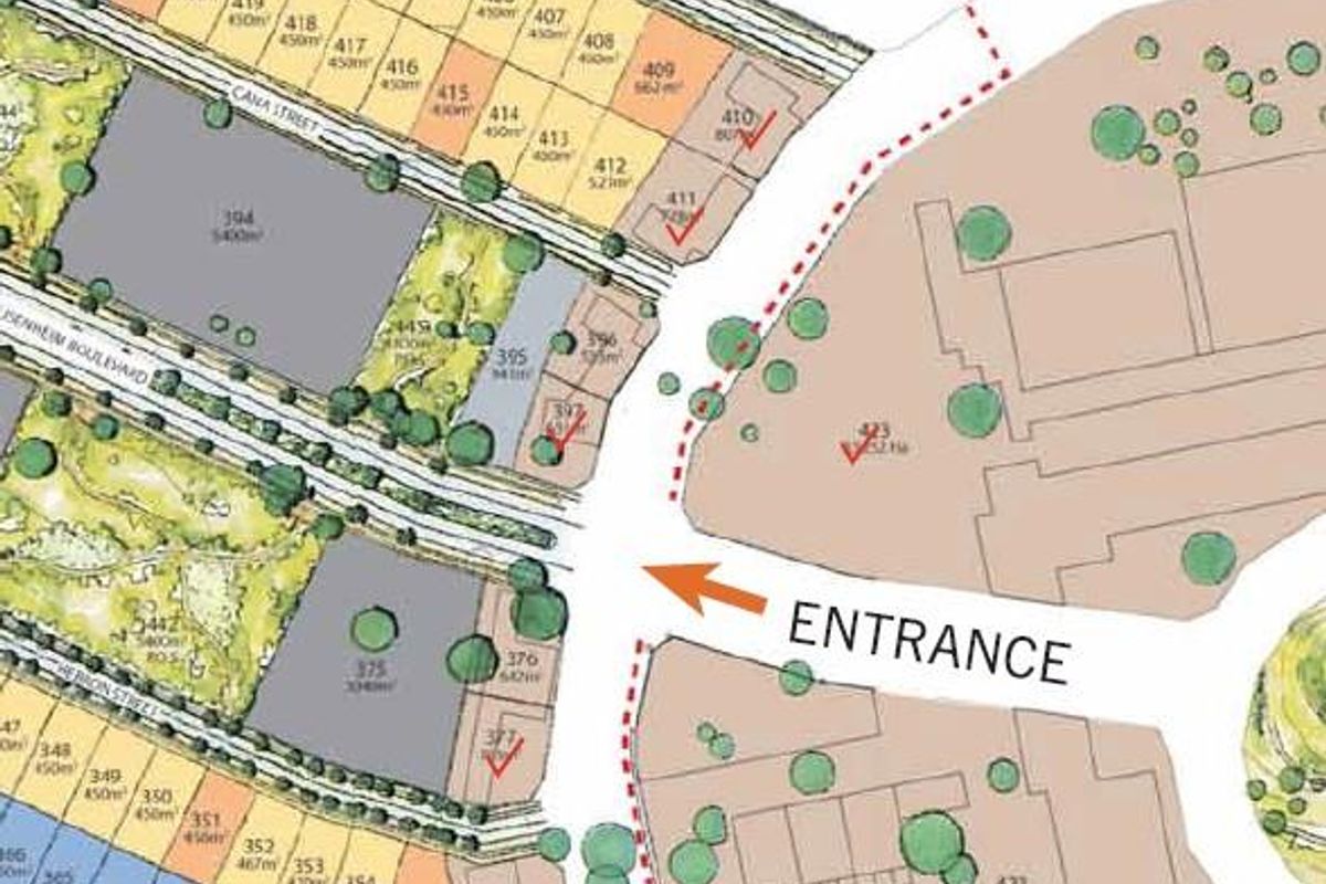 A site development plan showing the layout of commercial land plots, street access, and the main entrance to the estate.