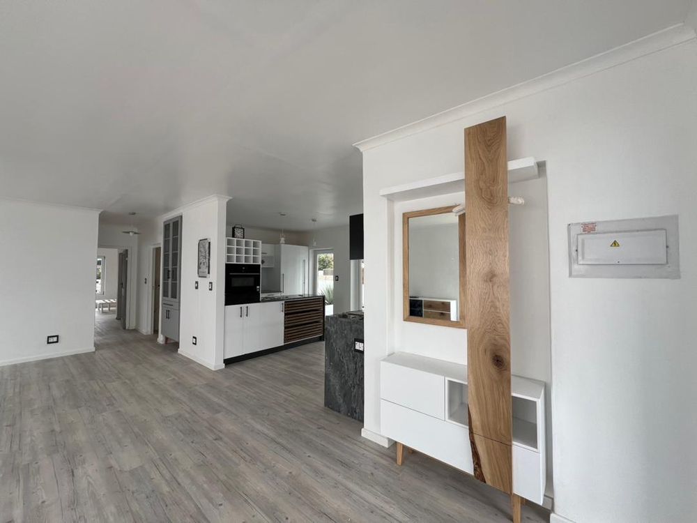 Open-plan kitchen, lounge and dining room upon entry