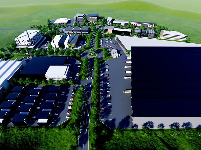 Aerial rendering of a large-scale industrial park development featuring multiple warehouse units, office buildings, and extensive parking infrastructure.